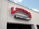 Legends Sports Bar lighted channel letters on a backplate in Highland Village, TX by Signs Manufacturing, Dallas, Texas.